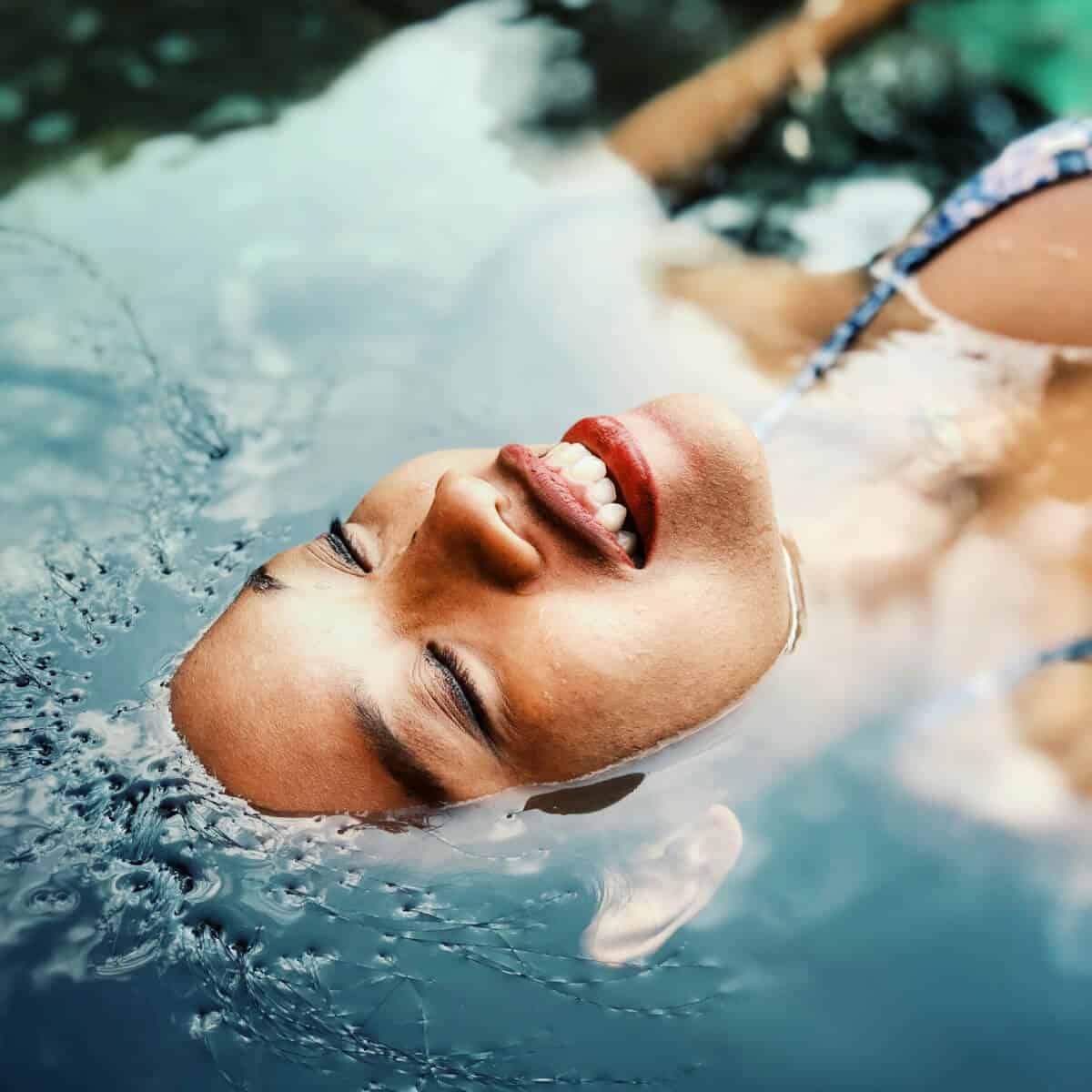 customer in a spa floating in water